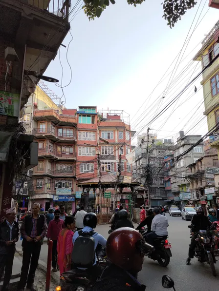 Street view of Thamel, Kathmandu packed with overhead cables and motor bikes.